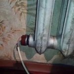 Støbejerns radiator med indbygget varmeelement