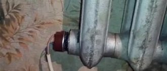 Cast iron heating radiator na may built-in na elemento ng pag-init
